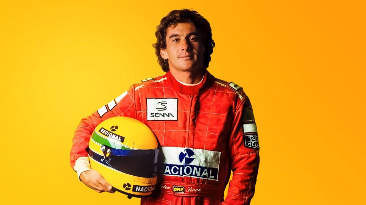 ayrton senna standing with helmet in his hands